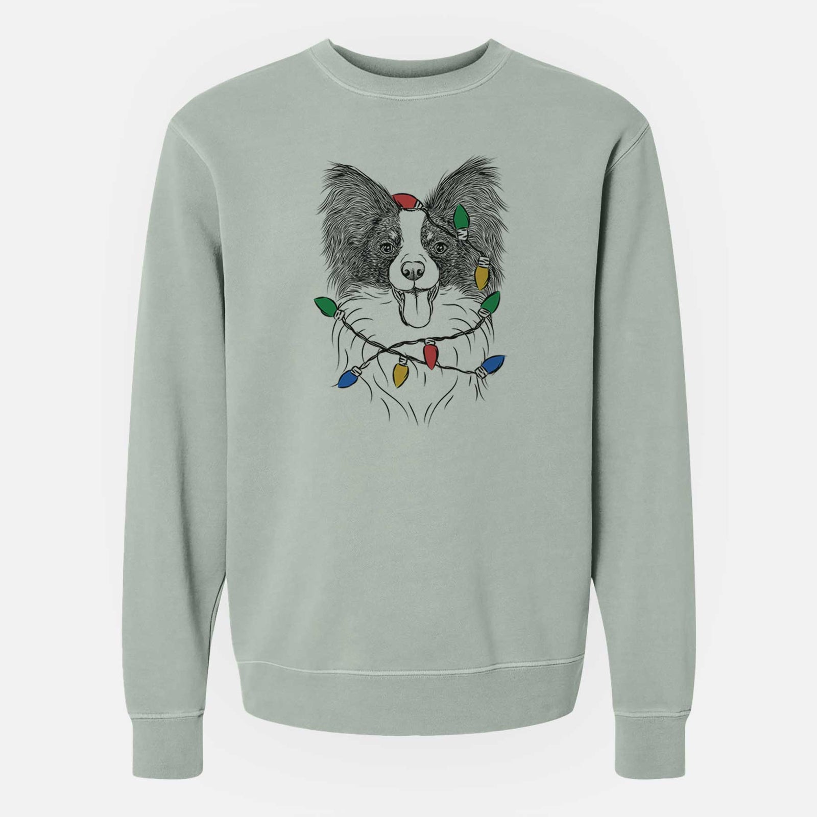 Hand-drawn sketch of Patrick the Papillon wrapped in Christmas lights on a Sage Unisex pigment dyed crew sweatshirt
