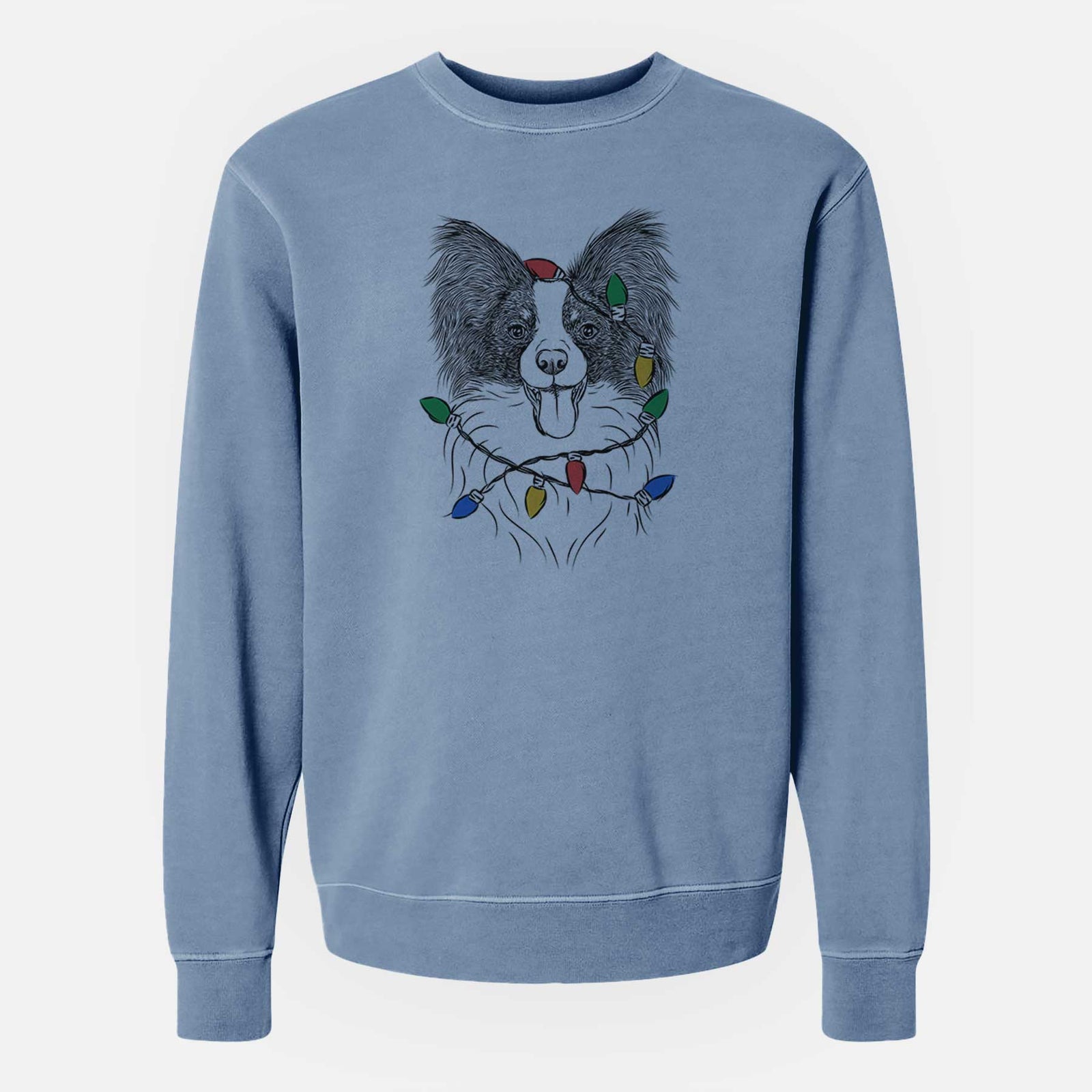 Hand-drawn sketch of Patrick the Papillon wrapped in Christmas lights on a Slate Blue Unisex pigment dyed crew sweatshirt