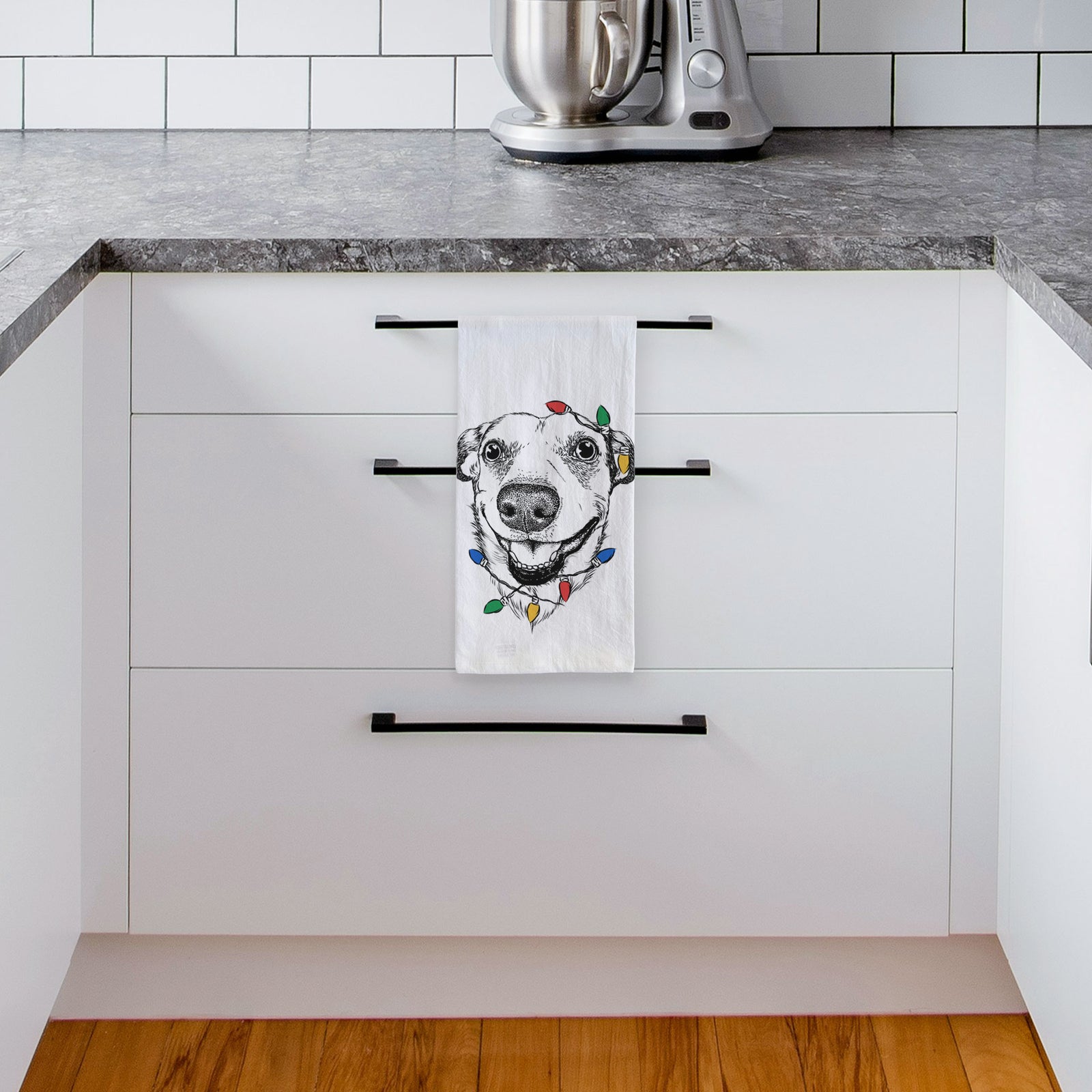 Hand-drawn sketch of Petrah the Staffy Mix wrapped in Christmas lights on a tea towel, hanging on an oven door in a kitchen