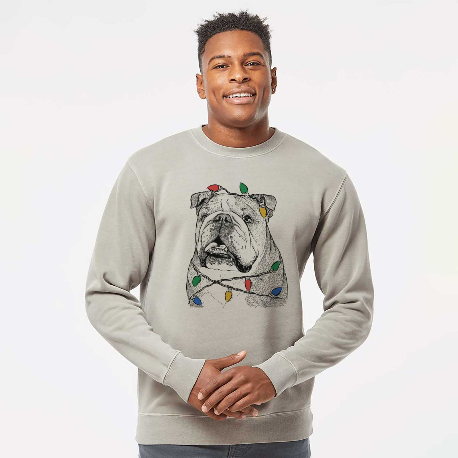 Hand-drawn sketch of Piggy the English Bulldog wrapped in Christmas lights on a Cement Unisex pigment dyed crew sweatshirt