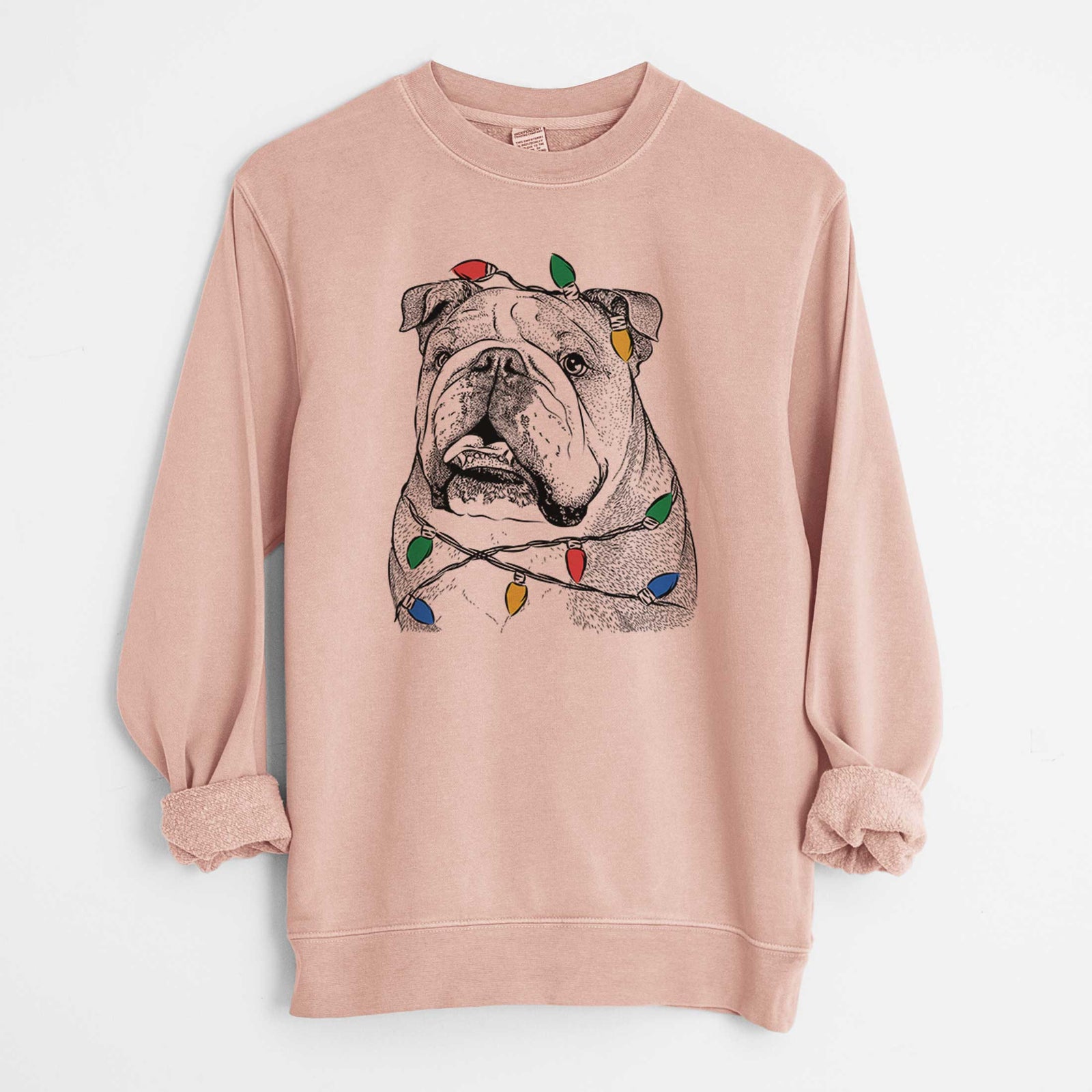 Hand-drawn sketch of Piggy the English Bulldog wrapped in Christmas lights on a Dusty Pink Unisex pigment dyed crew sweatshirt