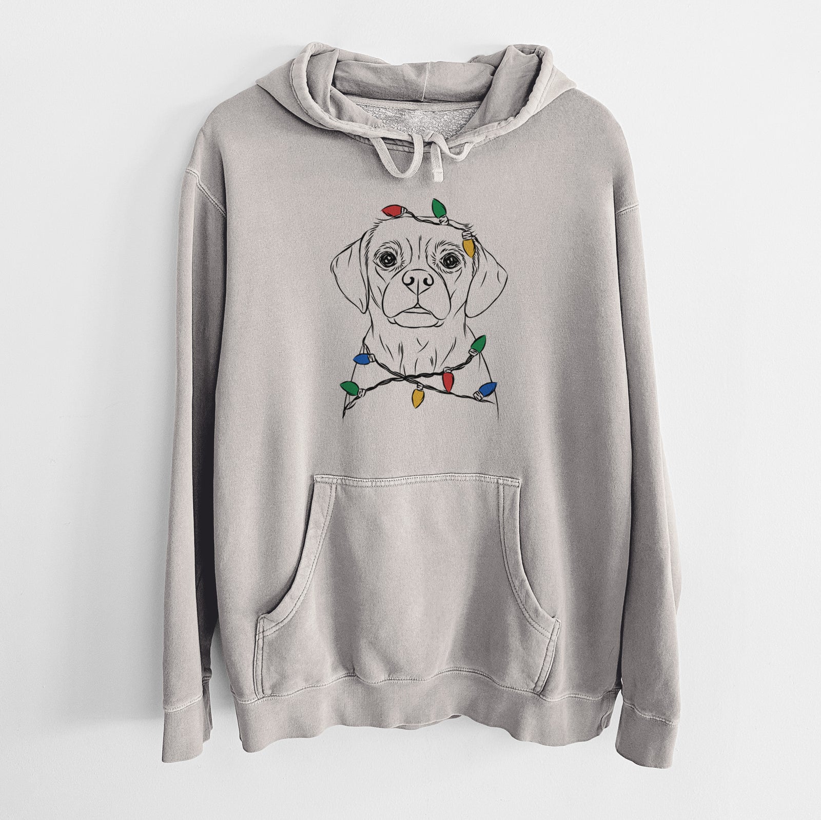 Hand-drawn sketch of Popcorn the Puggle wrapped in Christmas lights on a Cement Unisex pigment dyed hoodie