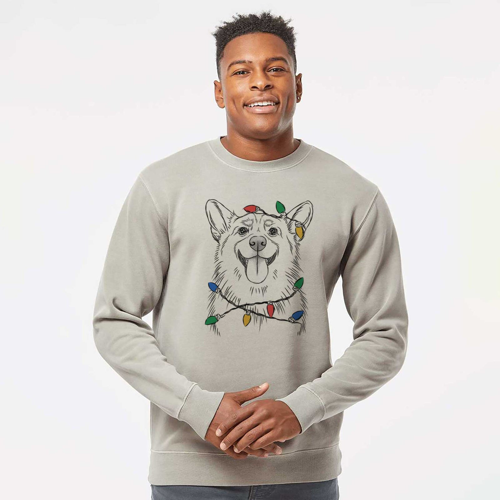 Hand-drawn sketch of Porter the Pembroke Welsh Corgi wrapped in Christmas lights on a Cement Unisex pigment dyed crew sweatshirt