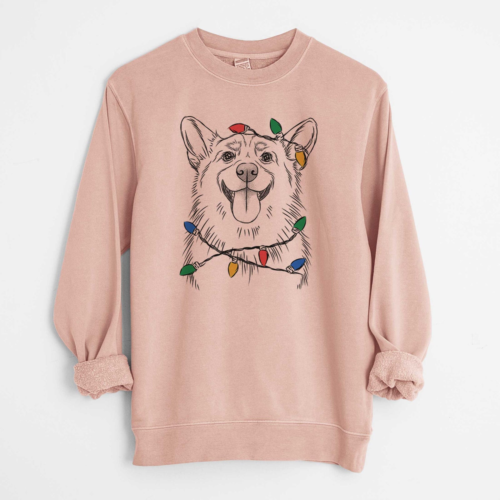 Hand-drawn sketch of Porter the Pembroke Welsh Corgi wrapped in Christmas lights on a Dusty Pink Unisex pigment dyed crew sweatshirt