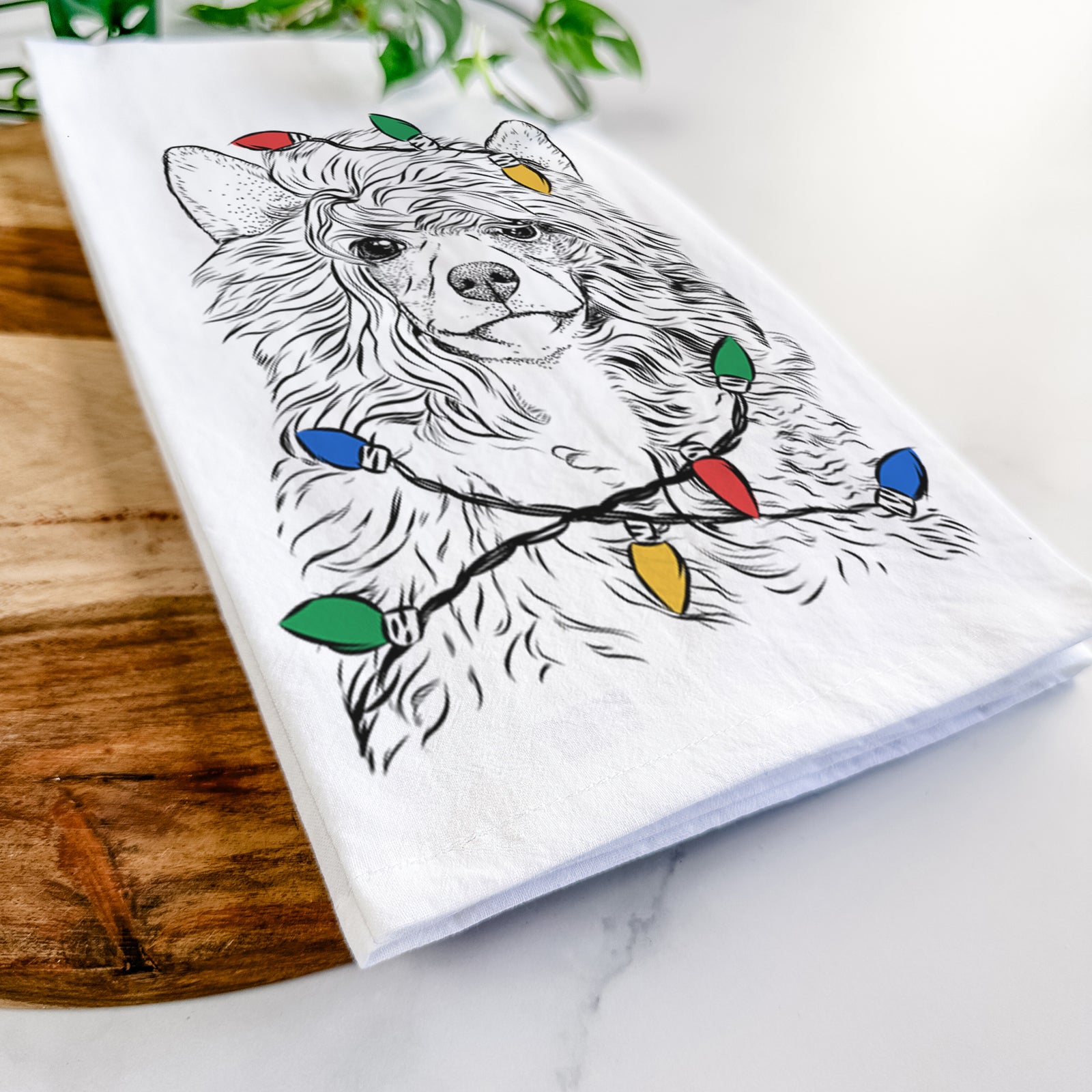 Hand-drawn sketch of Preston the Powderpuff Chinese Crested wrapped in Christmas lights on a tea towel