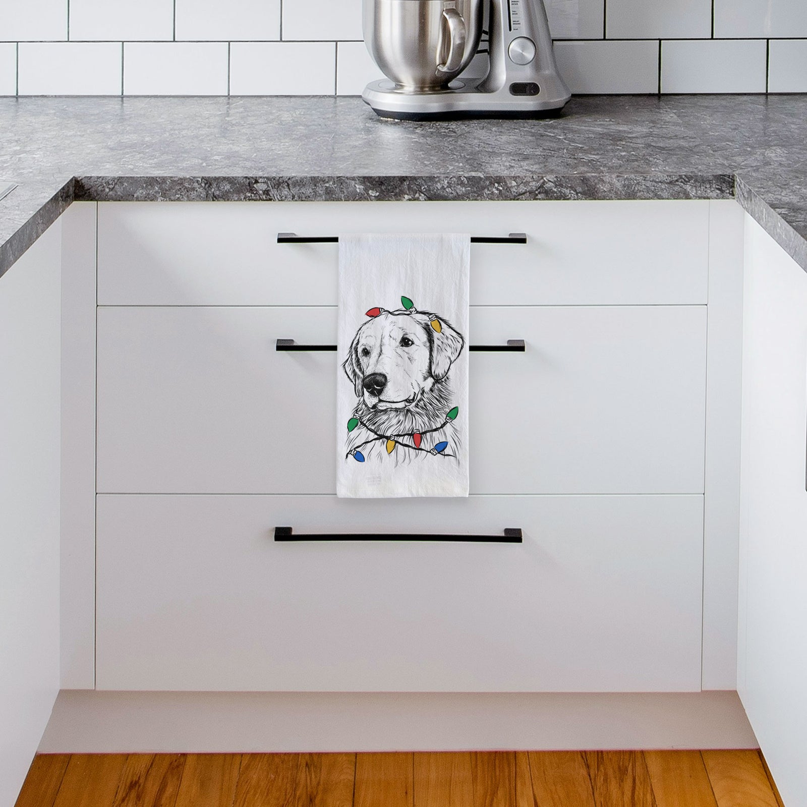 Hand-drawn sketch of Quinn the Golden Retriever wrapped in Christmas lights on a tea towel, hanging on an oven door in a kitchen