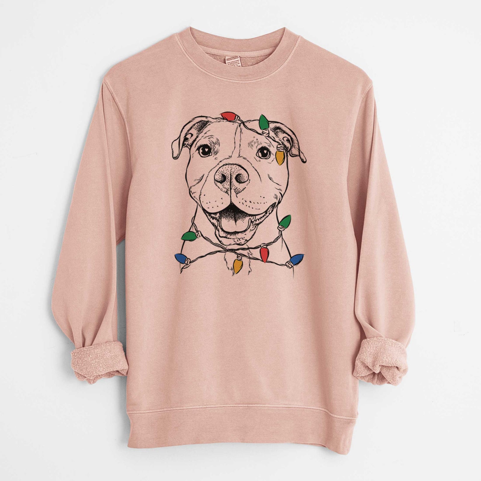 Hand-drawn sketch of Roscoe the Pitbull wrapped in Christmas lights on a Dusty Pink Unisex pigment dyed crew sweatshirt