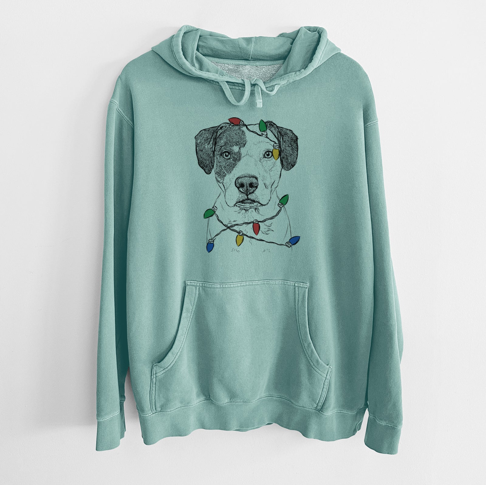 Hand-drawn sketch of Ryleigh the Beagle Pitbull Mix wrapped in Christmas lights on a Mint Unisex pigment dyed hoodie
