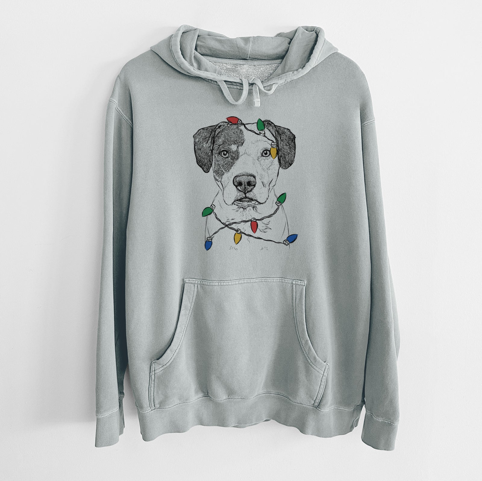 Hand-drawn sketch of Ryleigh the Beagle Pitbull Mix wrapped in Christmas lights on a Sage Unisex pigment dyed hoodie