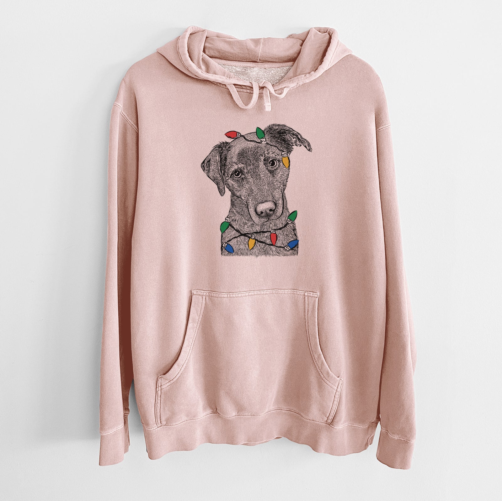 Hand-drawn sketch of Sadie the Whipador wrapped in Christmas lights on a Dusty Pink Unisex pigment dyed hoodie