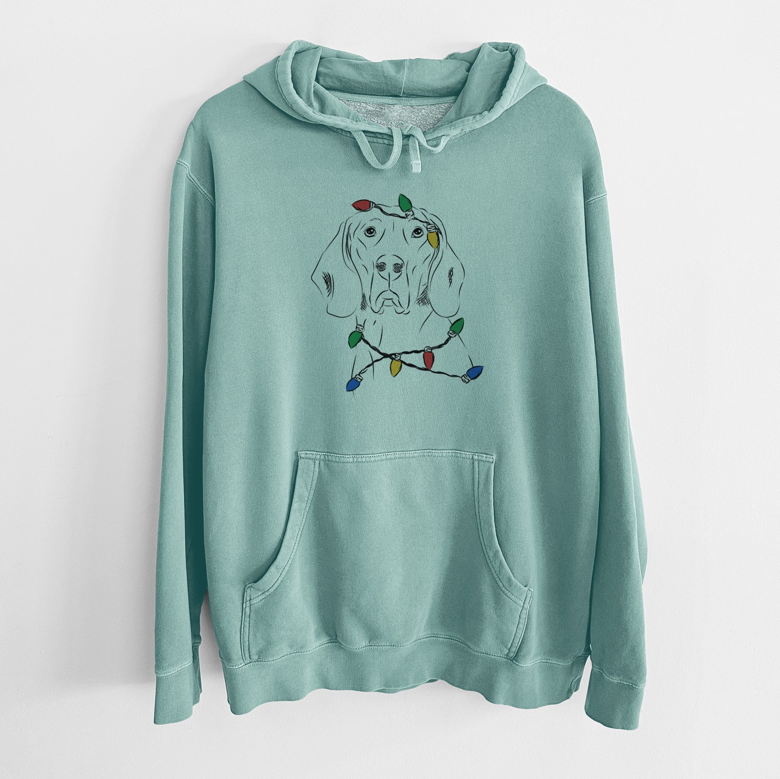 Hand-drawn sketch of Sagan the Coonhound wrapped in Christmas lights on a Mint Unisex pigment dyed hoodie