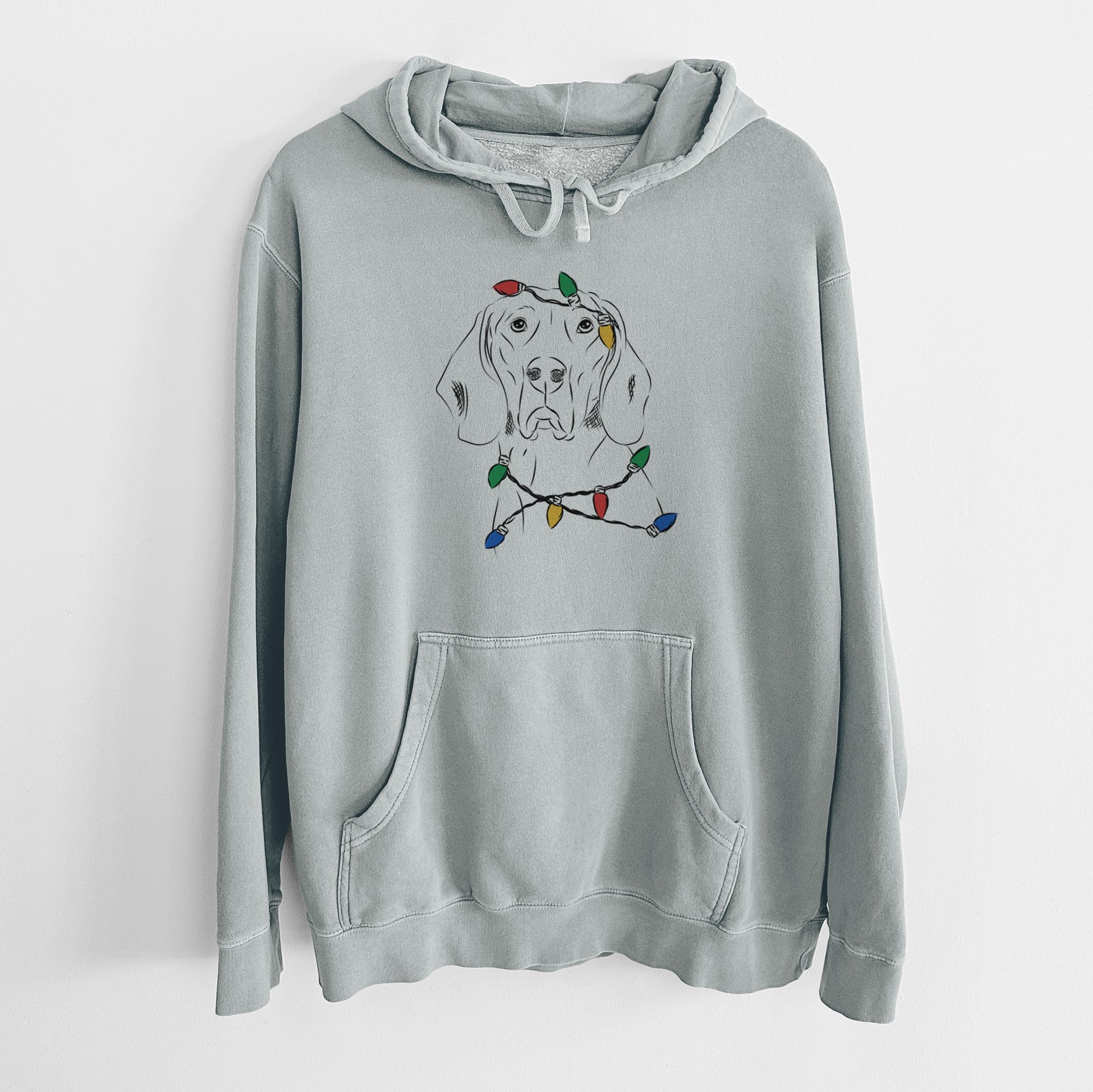 Hand-drawn sketch of Sagan the Coonhound wrapped in Christmas lights on a Sage Unisex pigment dyed hoodie