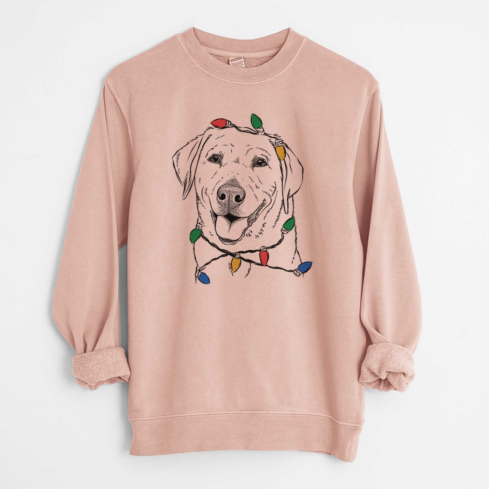 Hand-drawn sketch of Sanford the Labrador Retriever wrapped in Christmas lights on a Dusty Pink Unisex pigment dyed crew sweatshirt
