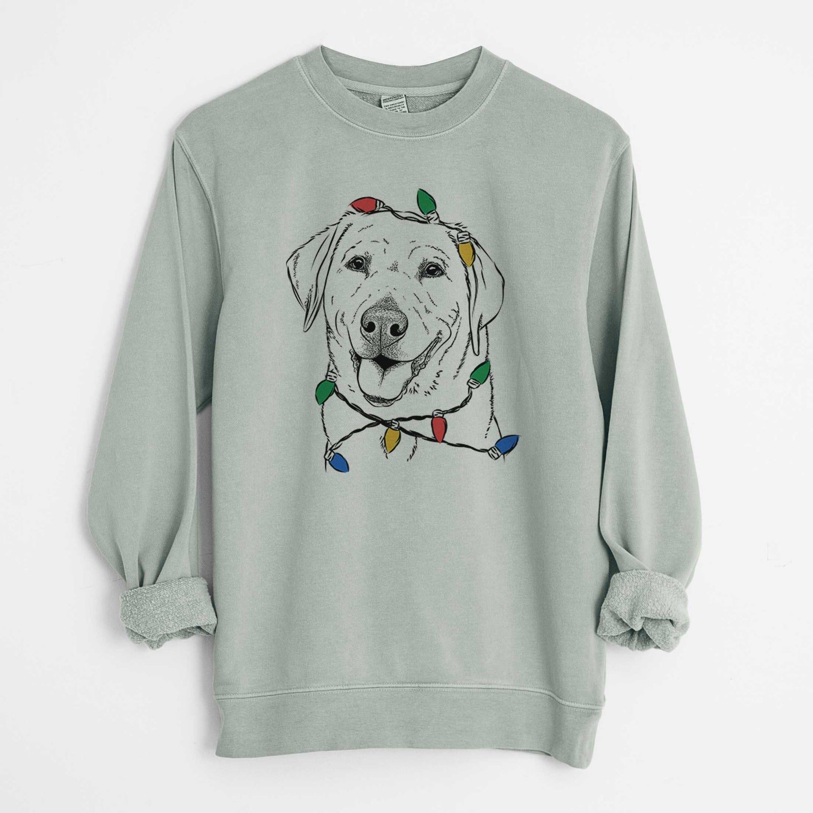 Hand-drawn sketch of Sanford the Labrador Retriever wrapped in Christmas lights on a Sage Unisex pigment dyed crew sweatshirt