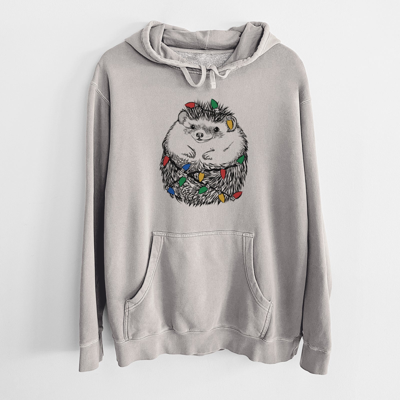Hand-drawn sketch of Sid the Hedgehog wrapped in Christmas lights on a Cement Unisex pigment dyed hoodie