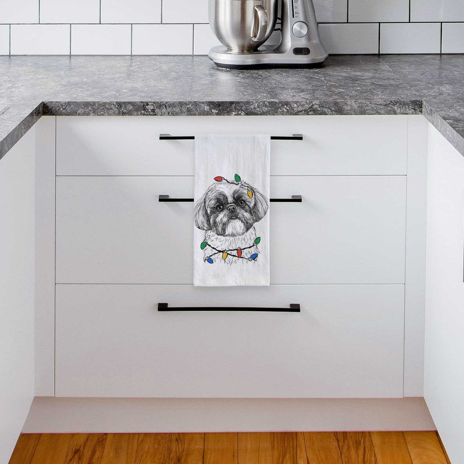 Hand-drawn sketch of Simon the Shih Tzu wrapped in Christmas lights on a tea towel, hanging on an oven door in a kitchen
