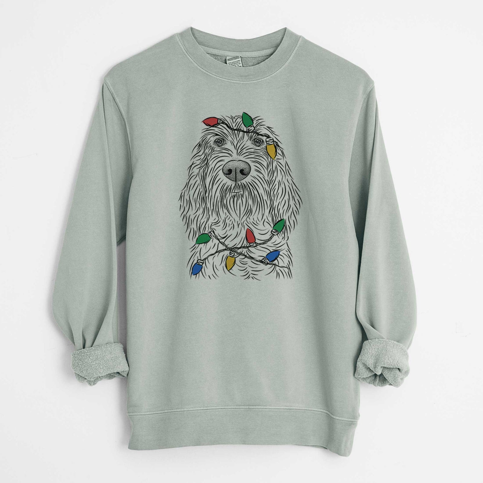 Hand-drawn sketch of Stefano the Spinone Italiano wrapped in Christmas lights on a Sage Unisex pigment dyed crew sweatshirt