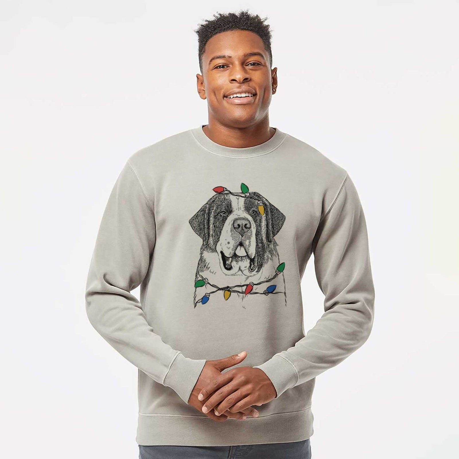 Hand-drawn sketch of Thor the Saint Bernard wrapped in Christmas lights on a Cement Unisex pigment dyed crew sweatshirt