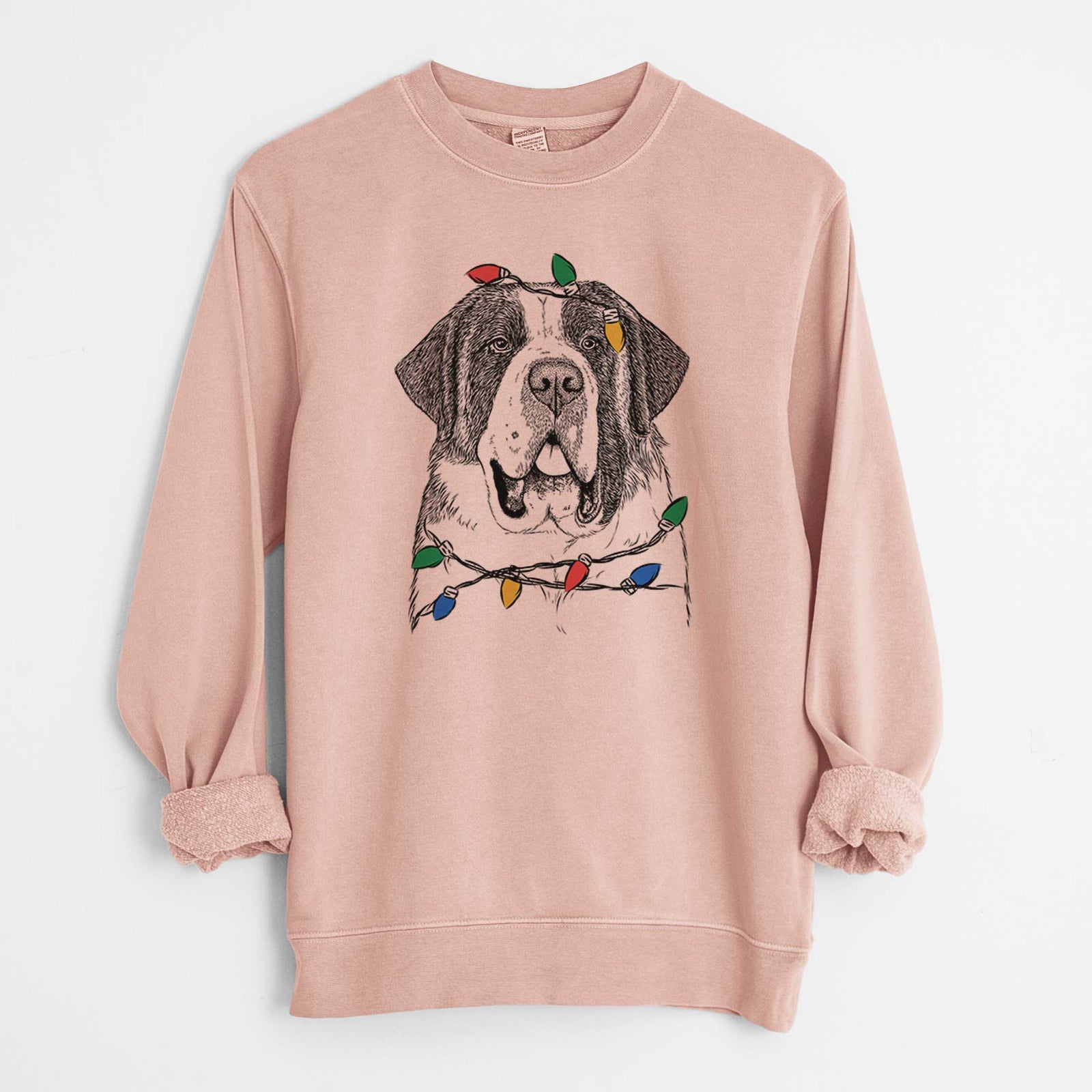 Hand-drawn sketch of Thor the Saint Bernard wrapped in Christmas lights on a Dusty Pink Unisex pigment dyed crew sweatshirt