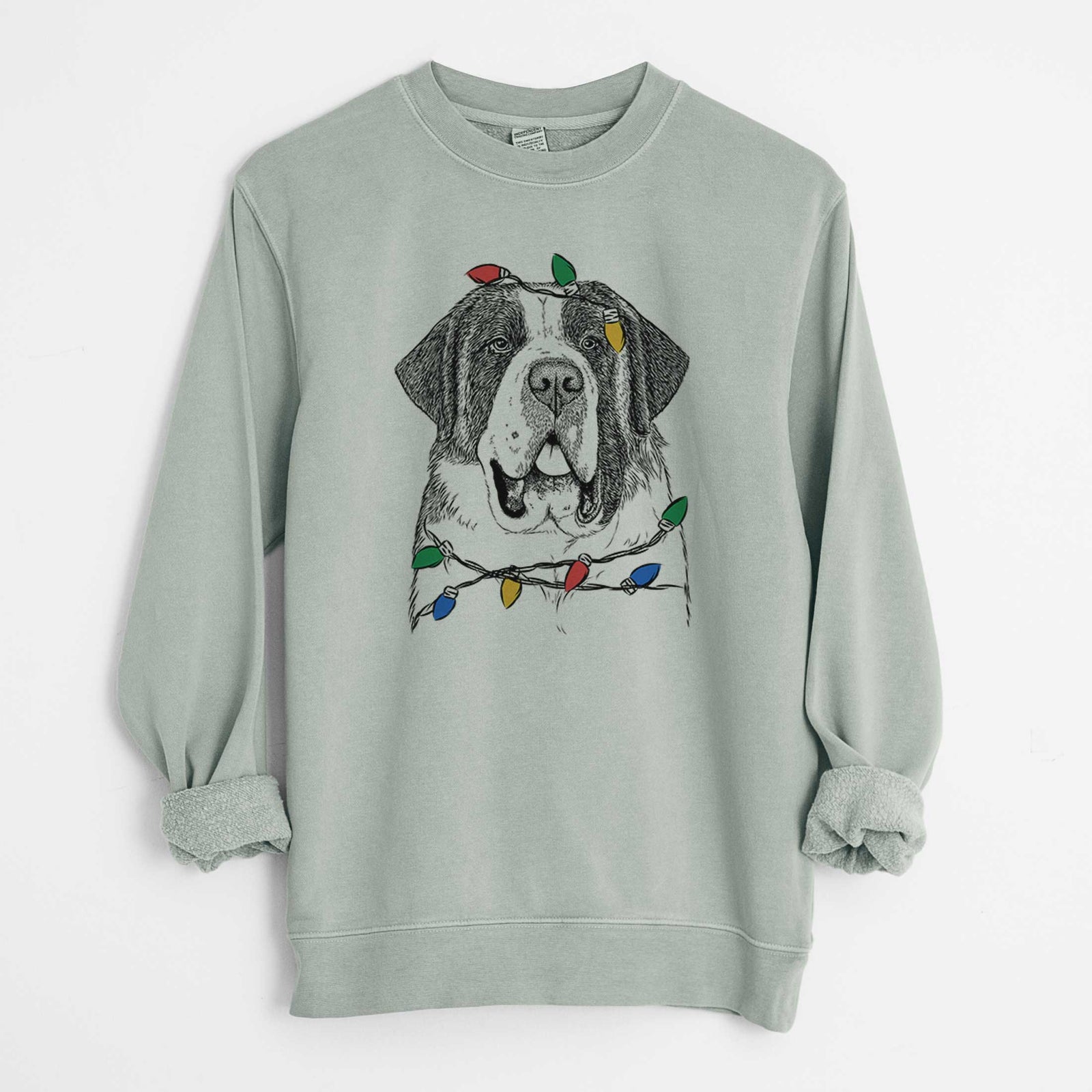 Hand-drawn sketch of Thor the Saint Bernard wrapped in Christmas lights on a Sage Unisex pigment dyed crew sweatshirt