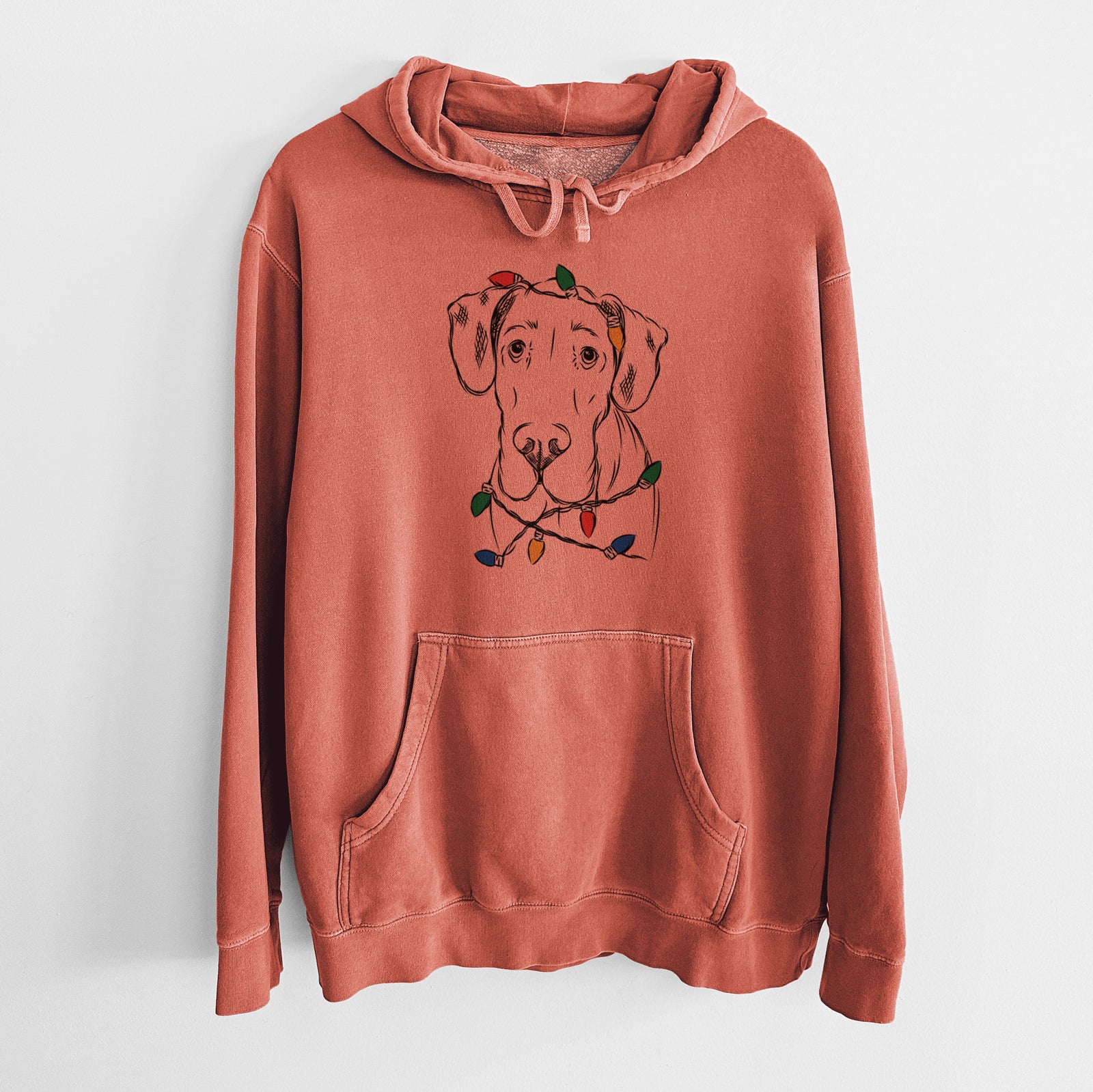 Hand-drawn sketch of Titus the Great Dane wrapped in Christmas lights on an Amber Unisex pigment dyed hoodie