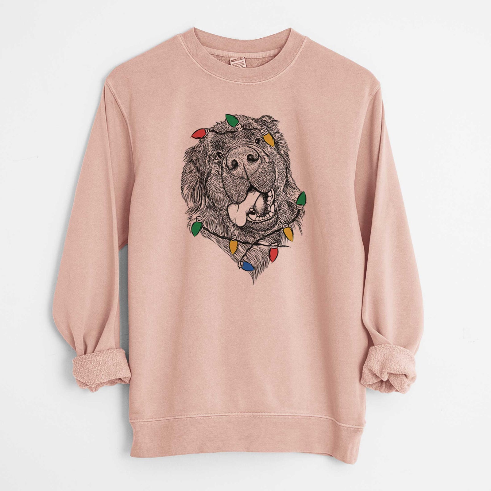 Hand-drawn sketch of Tuna the Newfoundland wrapped in Christmas lights on a Dusty Pink Unisex pigment dyed crew sweatshirt