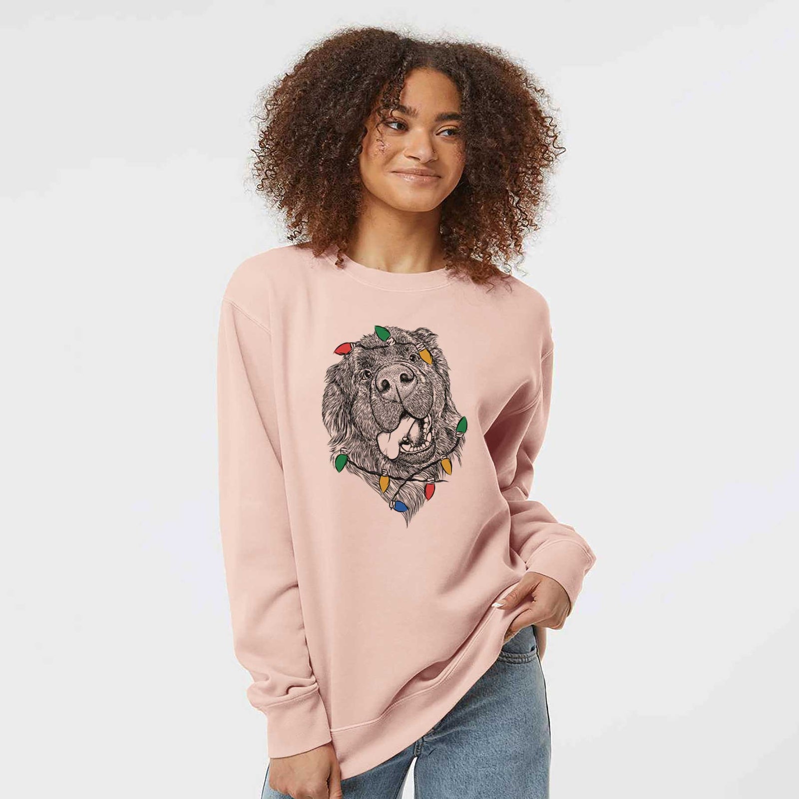 Hand-drawn sketch of Tuna the Newfoundland wrapped in Christmas lights on a Dusty Pink Unisex pigment dyed crew sweatshirt