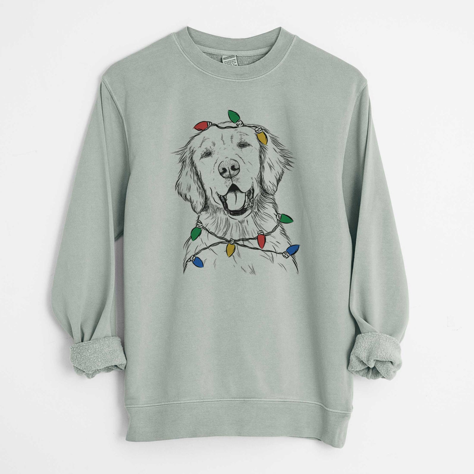 Hand-drawn sketch of Wallace the Golden Retriever wrapped in Christmas lights on a Sage Unisex pigment dyed crew sweatshirt