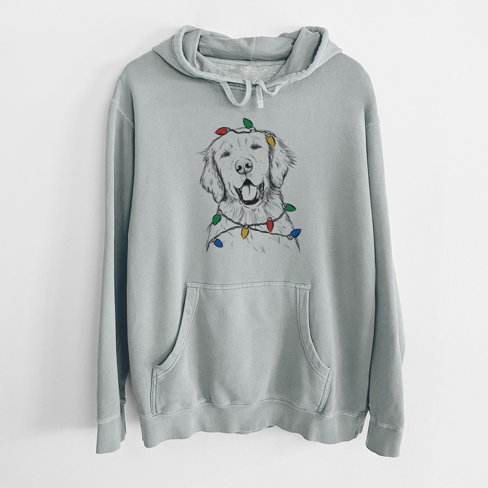 Hand-drawn sketch of Wallace the Golden Retriever wrapped in Christmas lights on a Sage Unisex pigment dyed hoodie