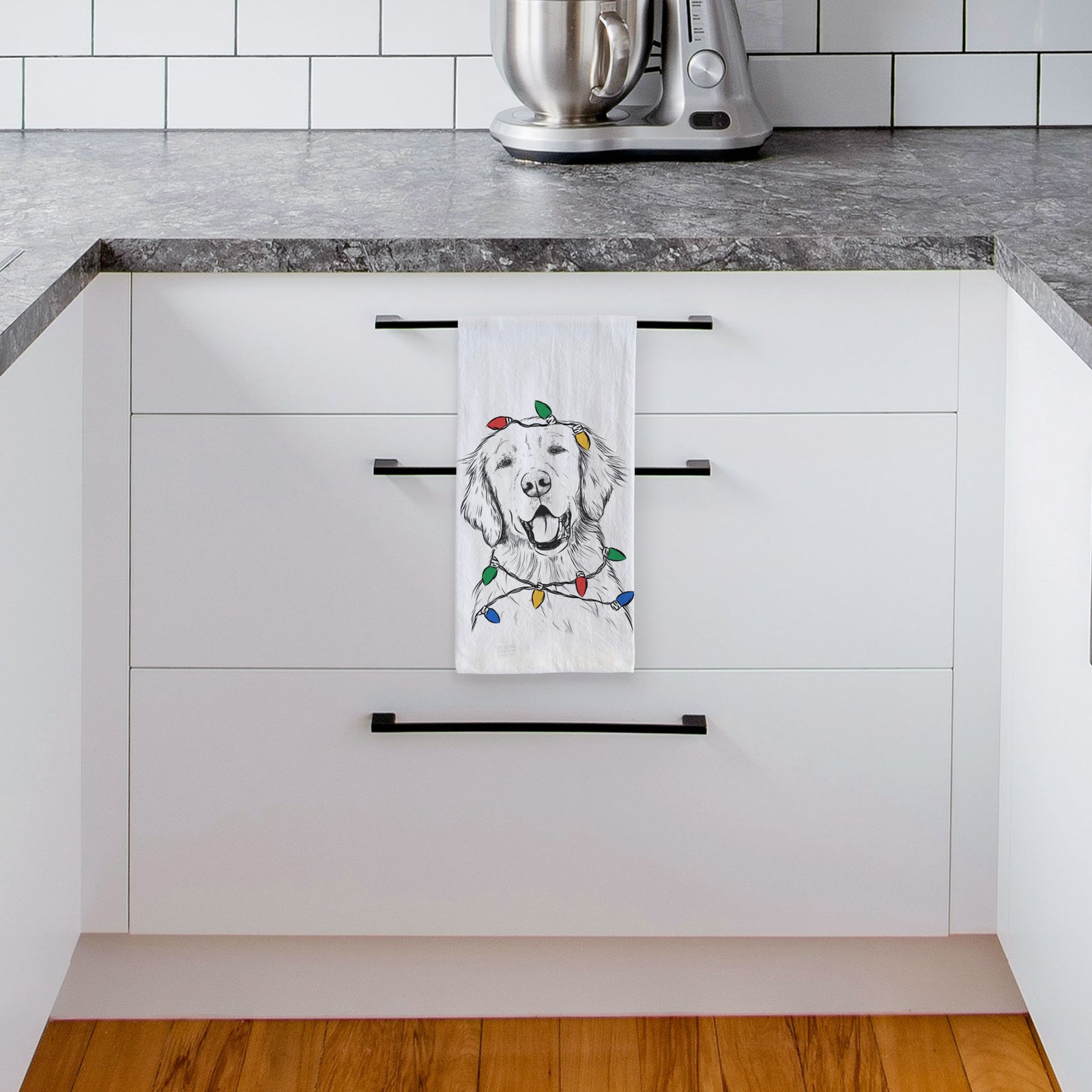 Hand-drawn sketch of Wallace the Golden Retriever wrapped in Christmas lights on a tea towel, hanging on an oven door in a kitchen