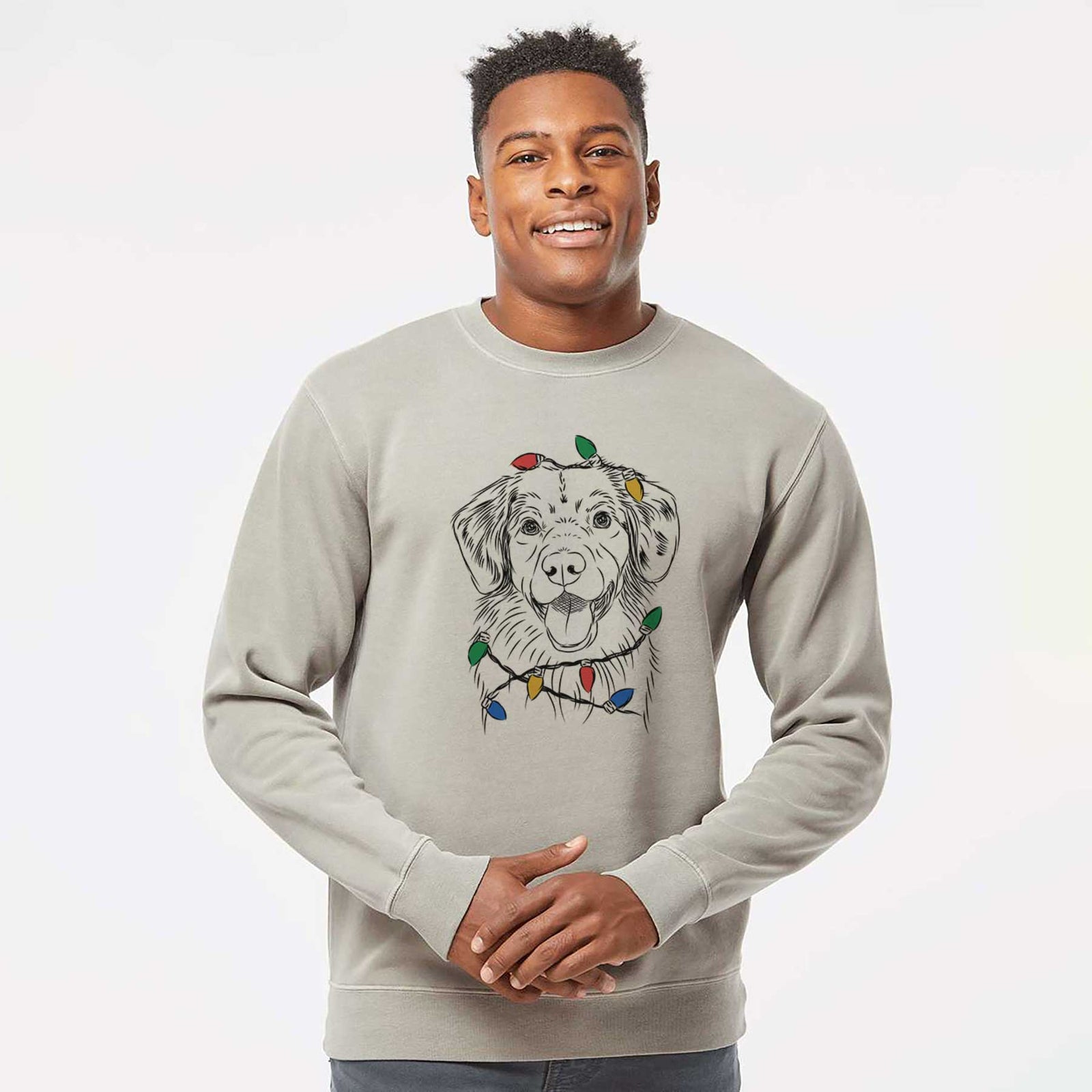 Hand-drawn sketch of Weston the Nova Scotia Duck Tolling Retriever wrapped in Christmas lights on a Cement Unisex pigment dyed crew sweatshirt