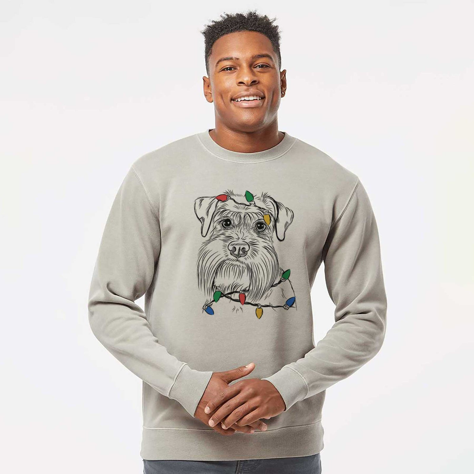 Hand-drawn sketch of Wrigley the Schnauzer wrapped in Christmas lights on a Cement Unisex pigment dyed crew sweatshirt