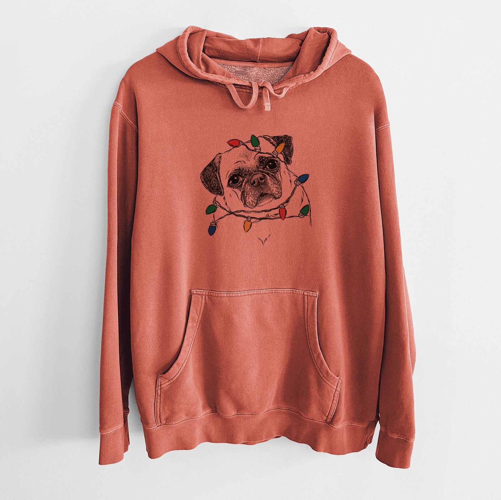 Hand-drawn sketch of Zoey the Pug wrapped in Christmas lights on an Amber Unisex pigment dyed hoodie