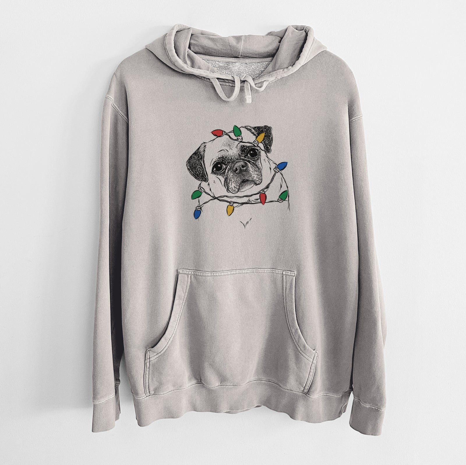 Hand-drawn sketch of Zoey the Pug wrapped in Christmas lights on a Cement Unisex pigment dyed hoodie