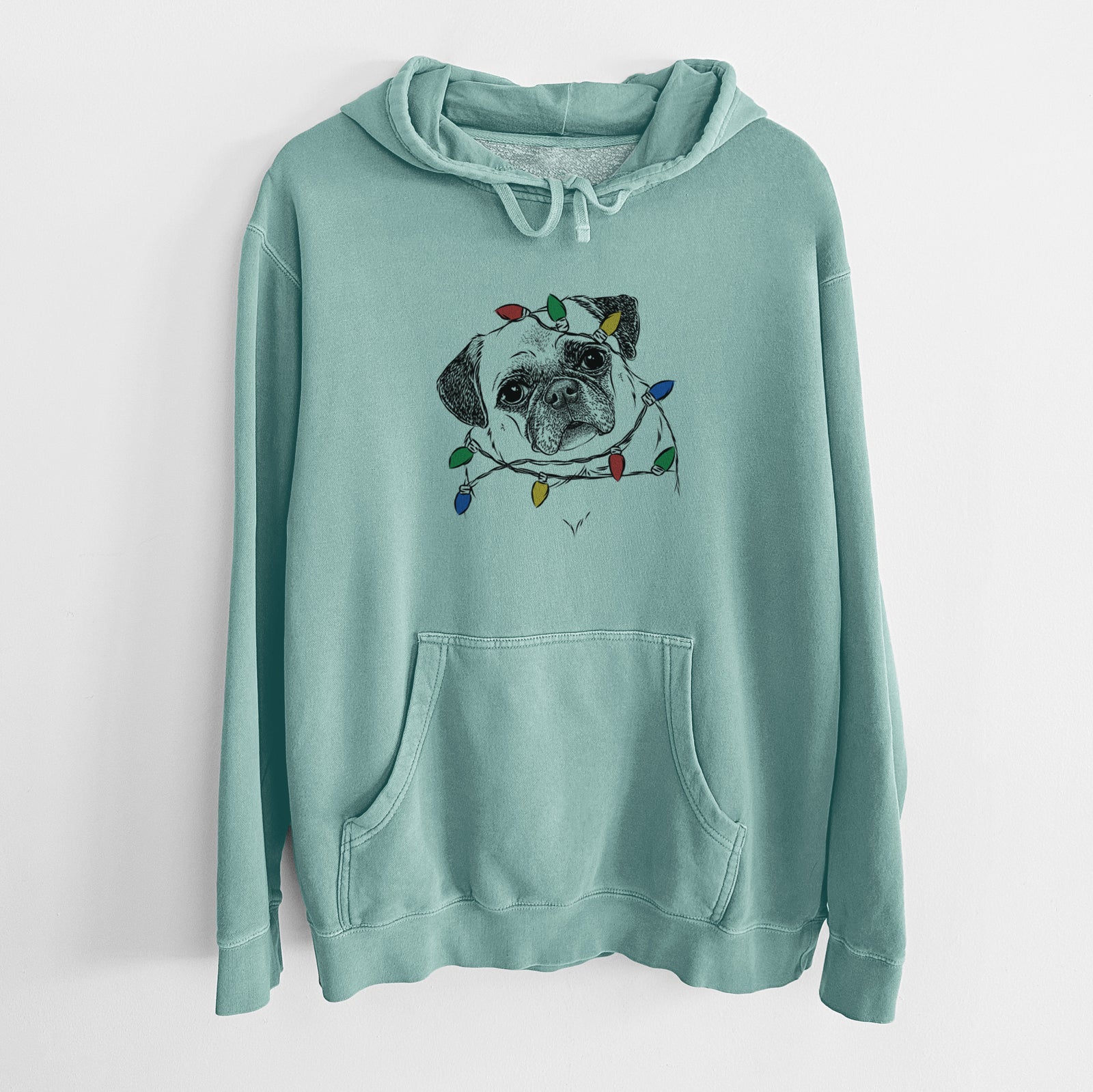 Hand-drawn sketch of Zoey the Pug wrapped in Christmas lights on a Mint Unisex pigment dyed hoodie
