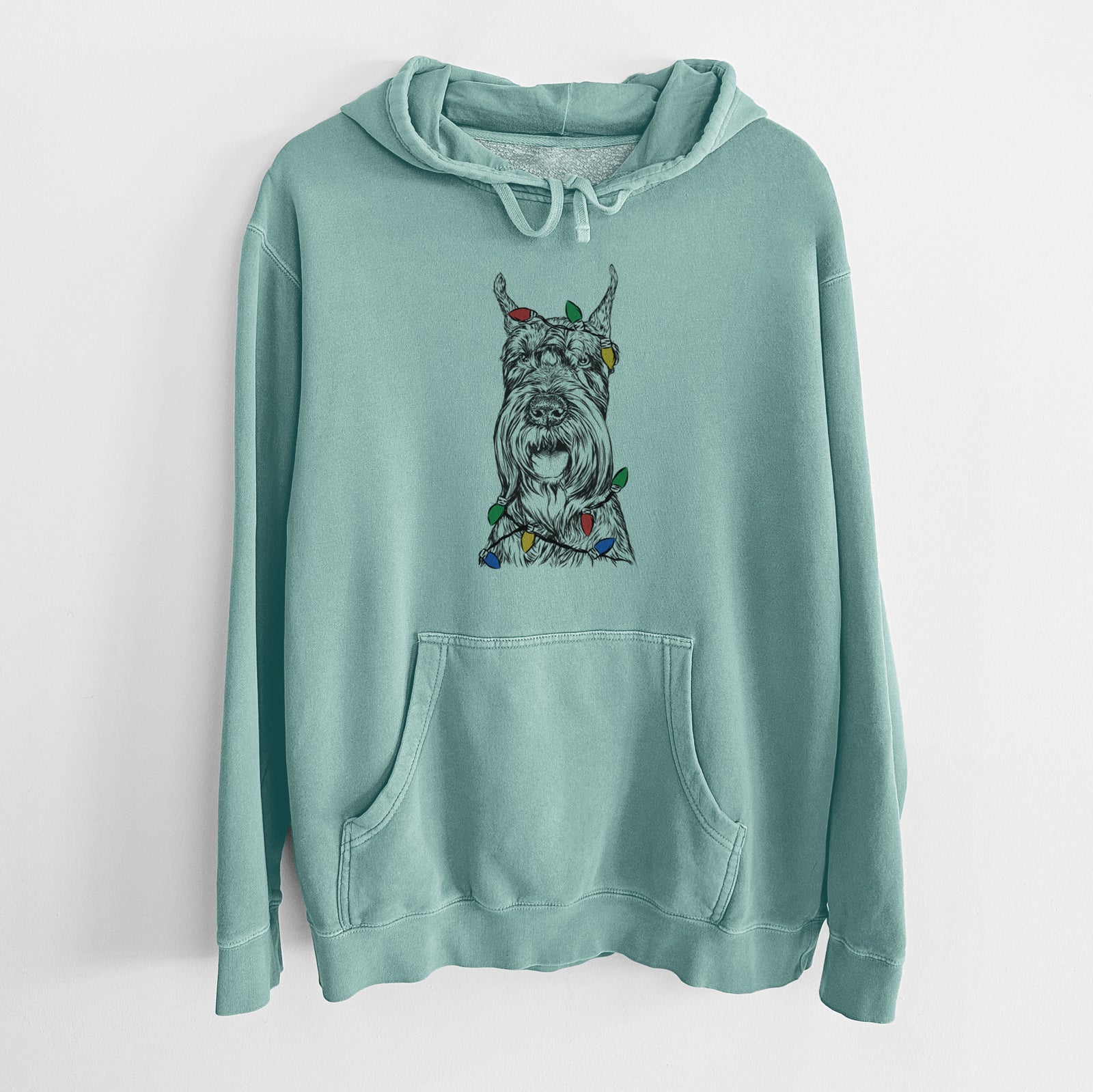 Hand-drawn sketch of Zuri the Giant Schnauzer wrapped in Christmas lights on a Mint Unisex pigment dyed hoodie