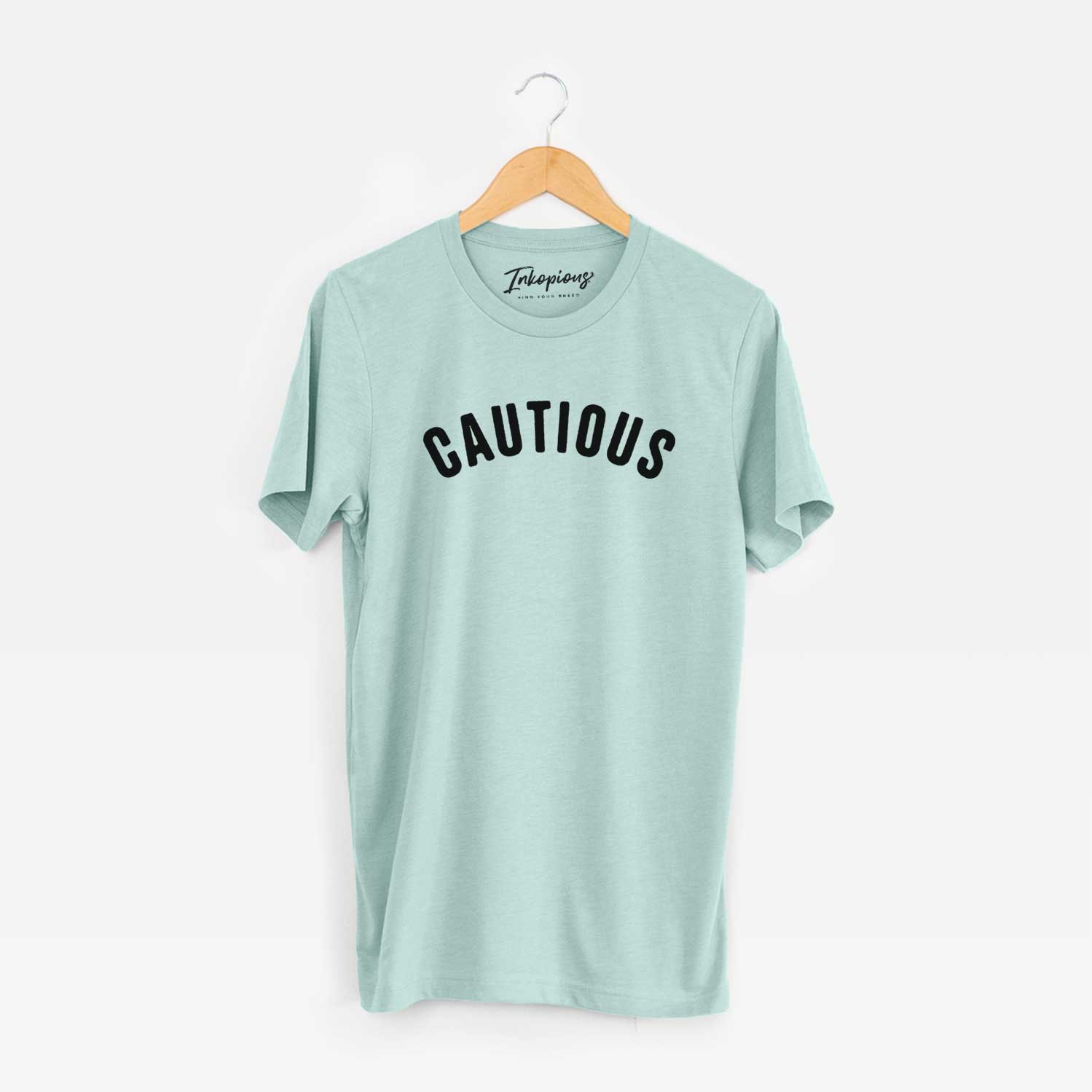 'Cautious - Articulate Collection' design on a Heather Sage Unisex crewneck