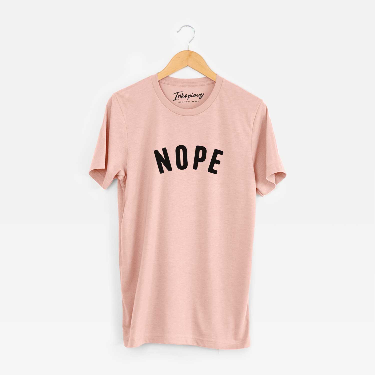 'Nope - Articulate Collection' design on a Peach Unisex crewneck