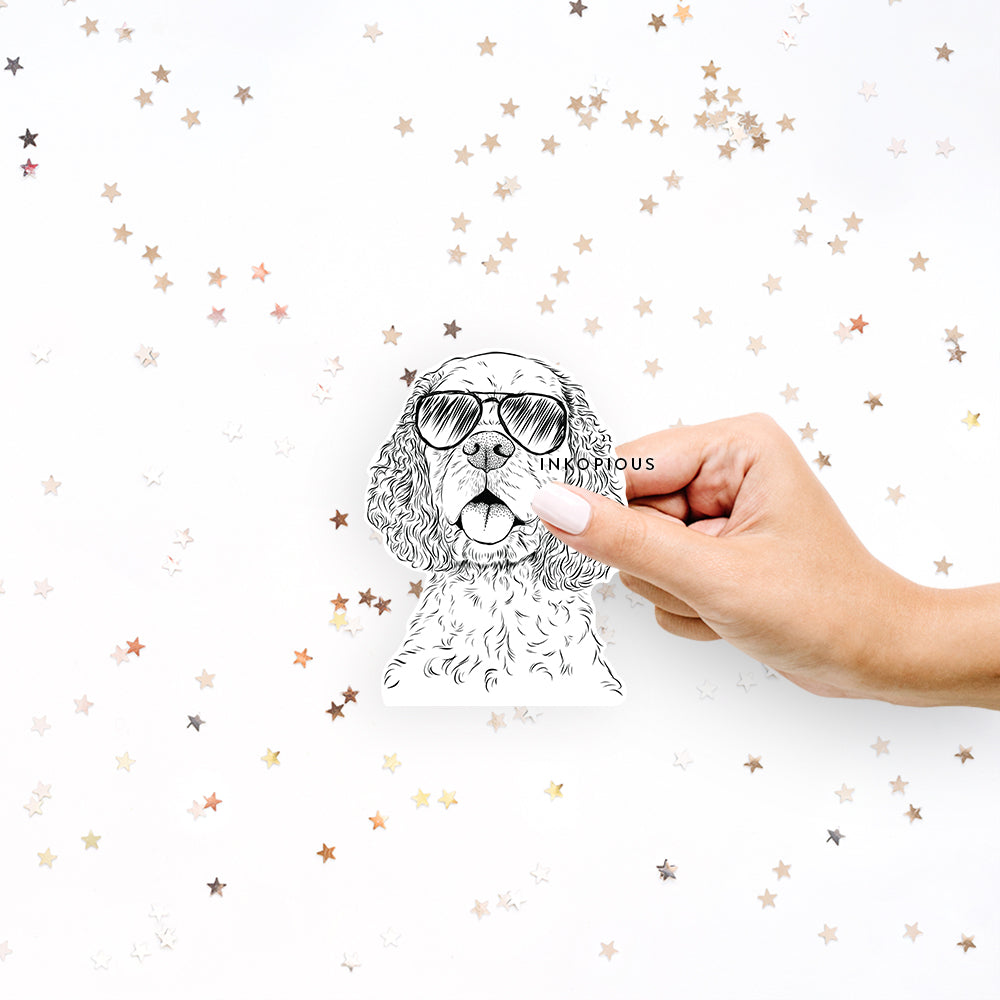 Hand-drawn sketch of Baxter the Cocker Spaniel wearing aviator sunglasses on a decal sticker