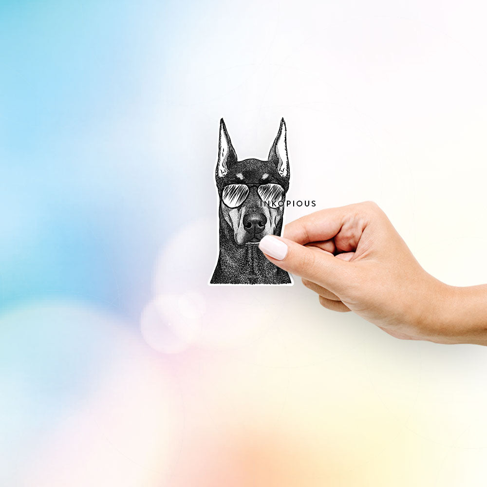 Hand-drawn sketch of Drake the Doberman Pinscher wearing aviator sunglasses on a decal sticker