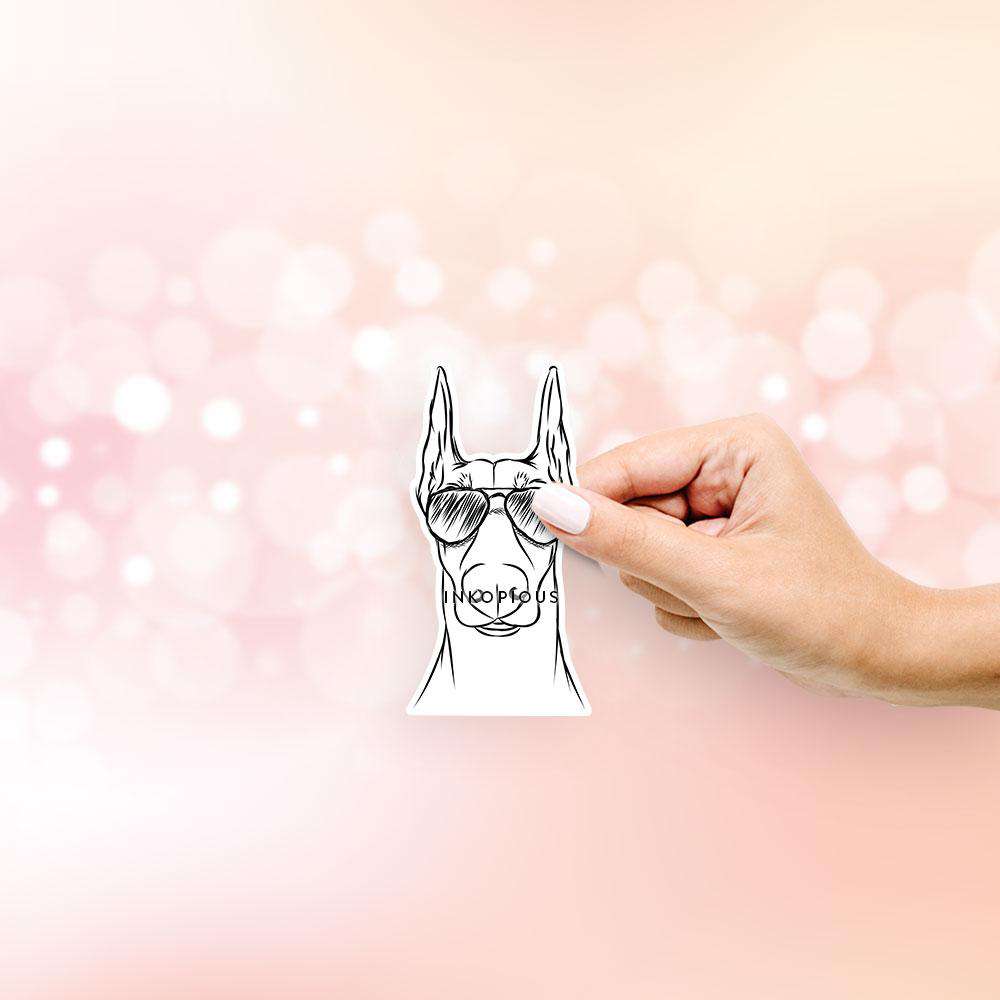 Hand-drawn sketch of Duke the Doberman wearing aviator sunglasses on a decal sticker