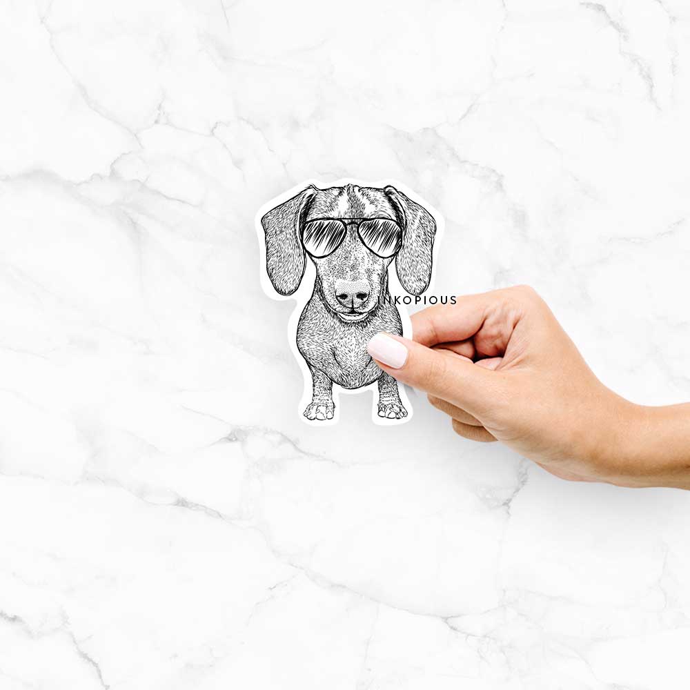Hand-drawn sketch of Ernie the Dachshund wearing aviator sunglasses on a decal sticker