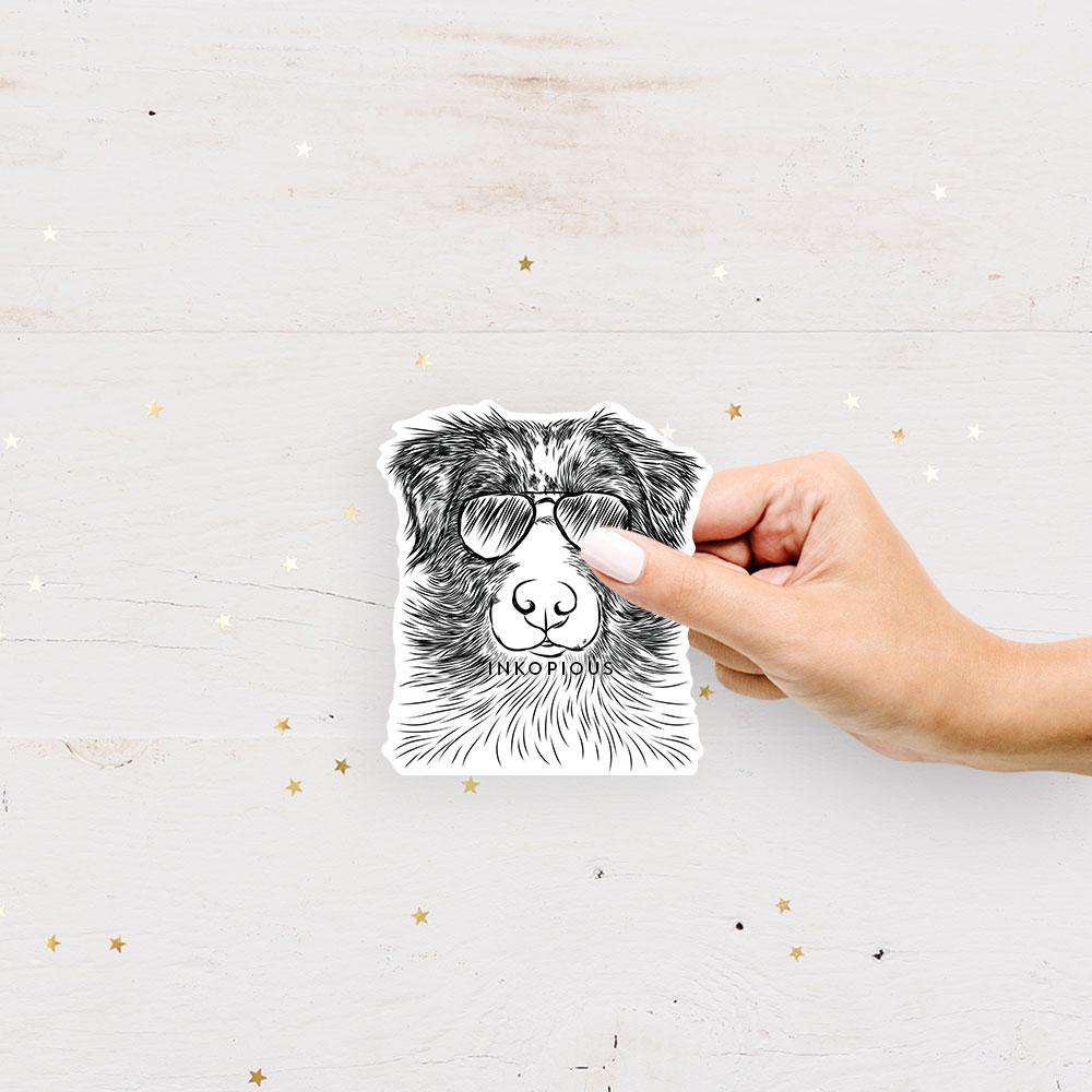Hand-drawn sketch of Gram the Australian Shepherd wearing aviator sunglasses on an Aussie decal sticker