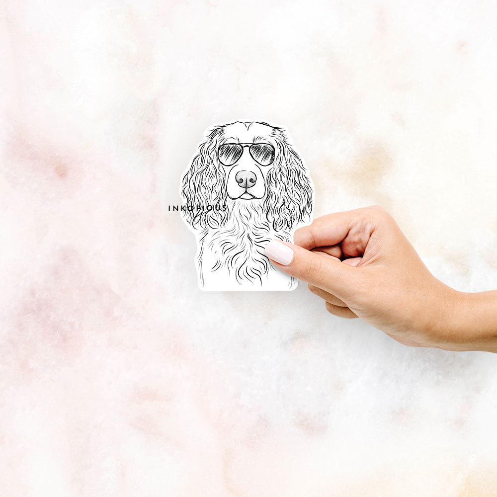 Hand-drawn sketch of Landry the Boykin Spaniel wearing aviator sunglasses on a decal sticker