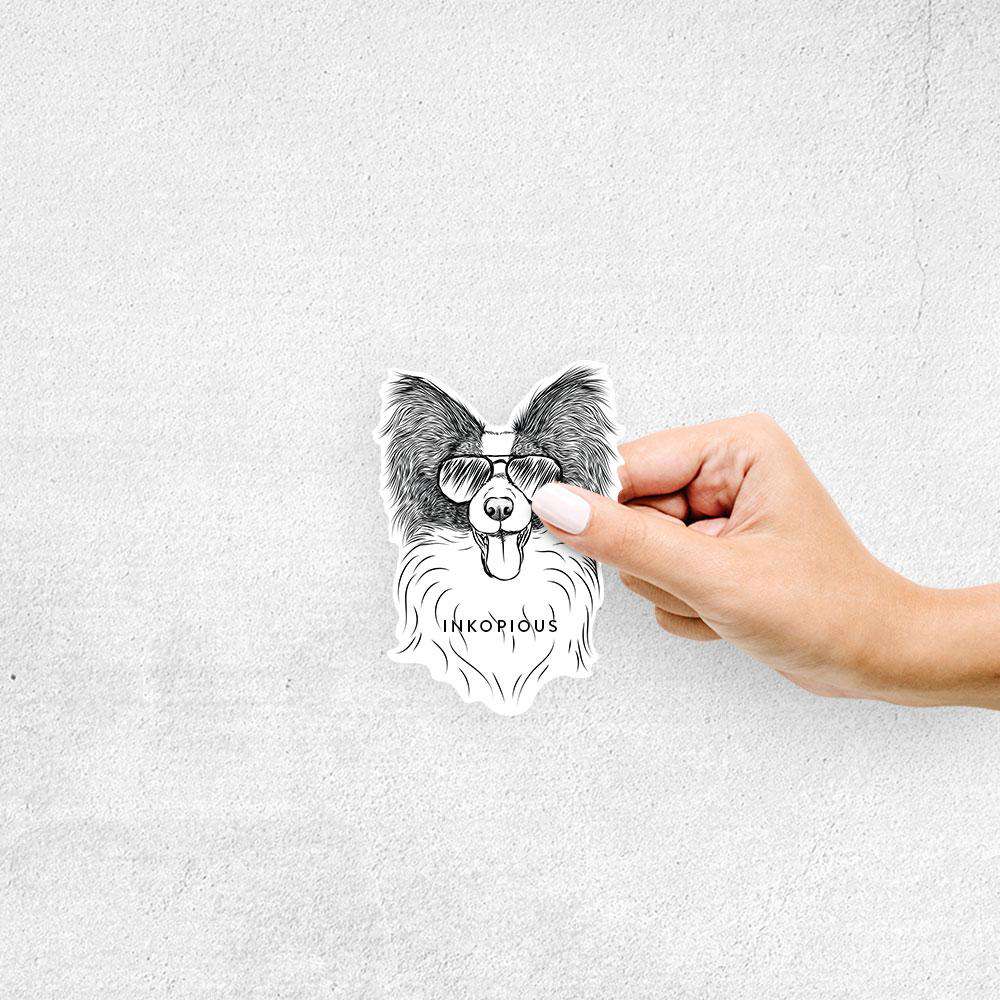 Hand-drawn sketch of Patrick the Papillon wearing aviator sunglasses on a Papillion decal sticker