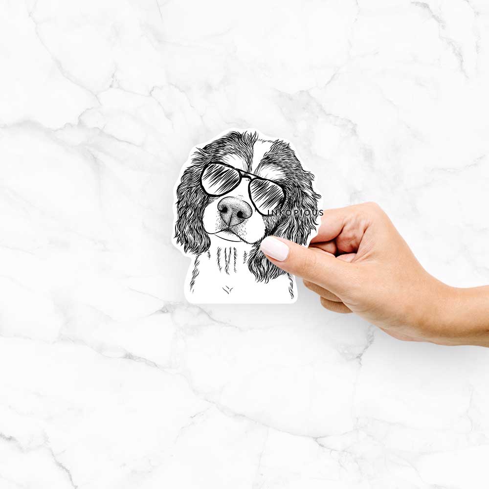 Hand-drawn sketch of Truman the Cavalier King Charles Spaniel wearing aviator sunglasses on a Truman Cav King Charles decal sticker