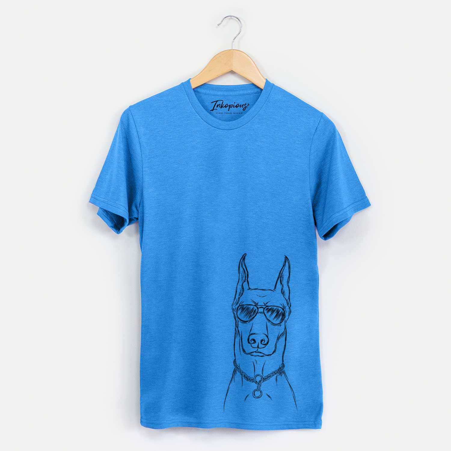 Hand-drawn sketch of Ace the Doberman Pinscher wearing aviator sunglasses on a Blue Unisex crewneck