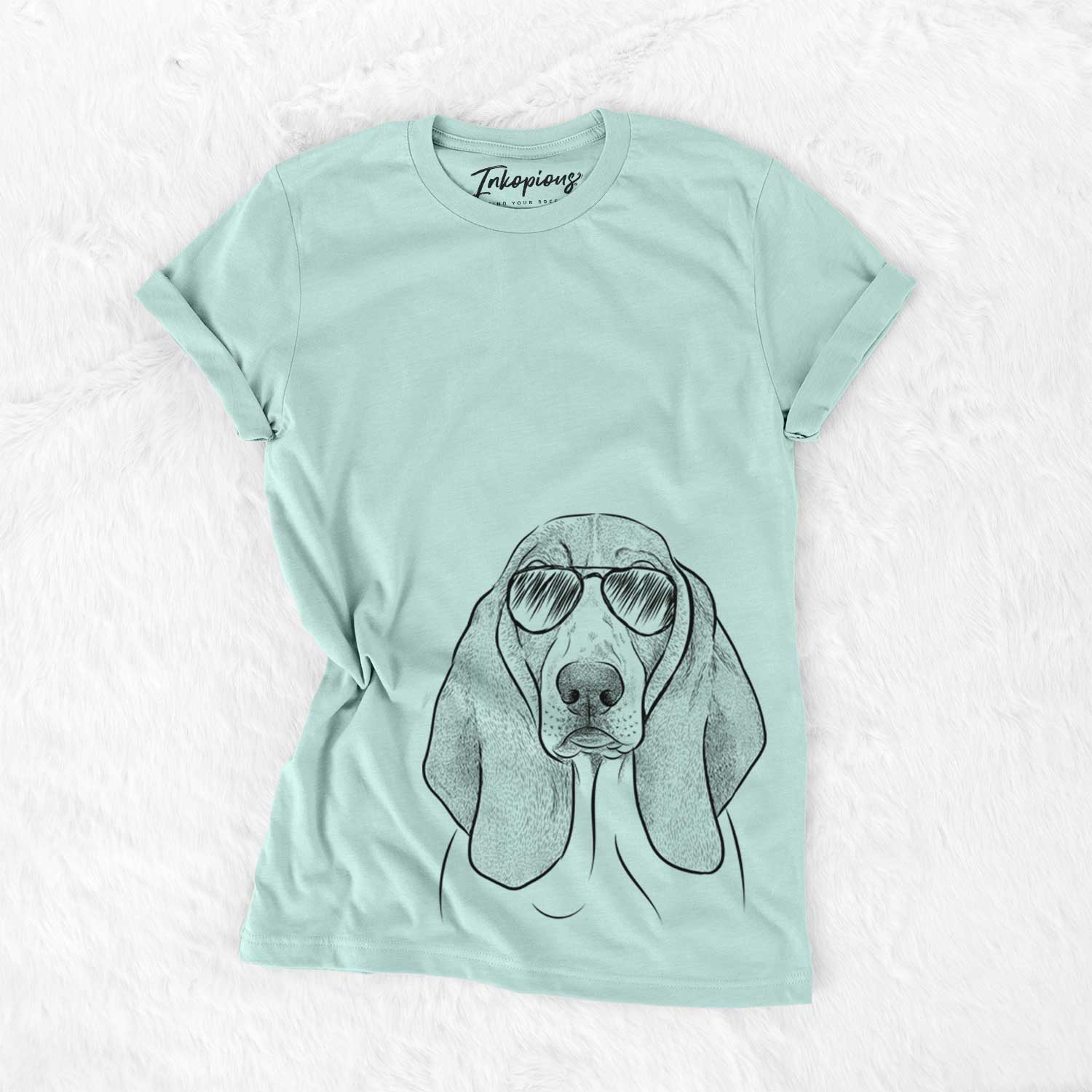 Hand-drawn sketch of Addison the Basset Hound wearing aviator sunglasses on a Heather Sage Unisex crewneck