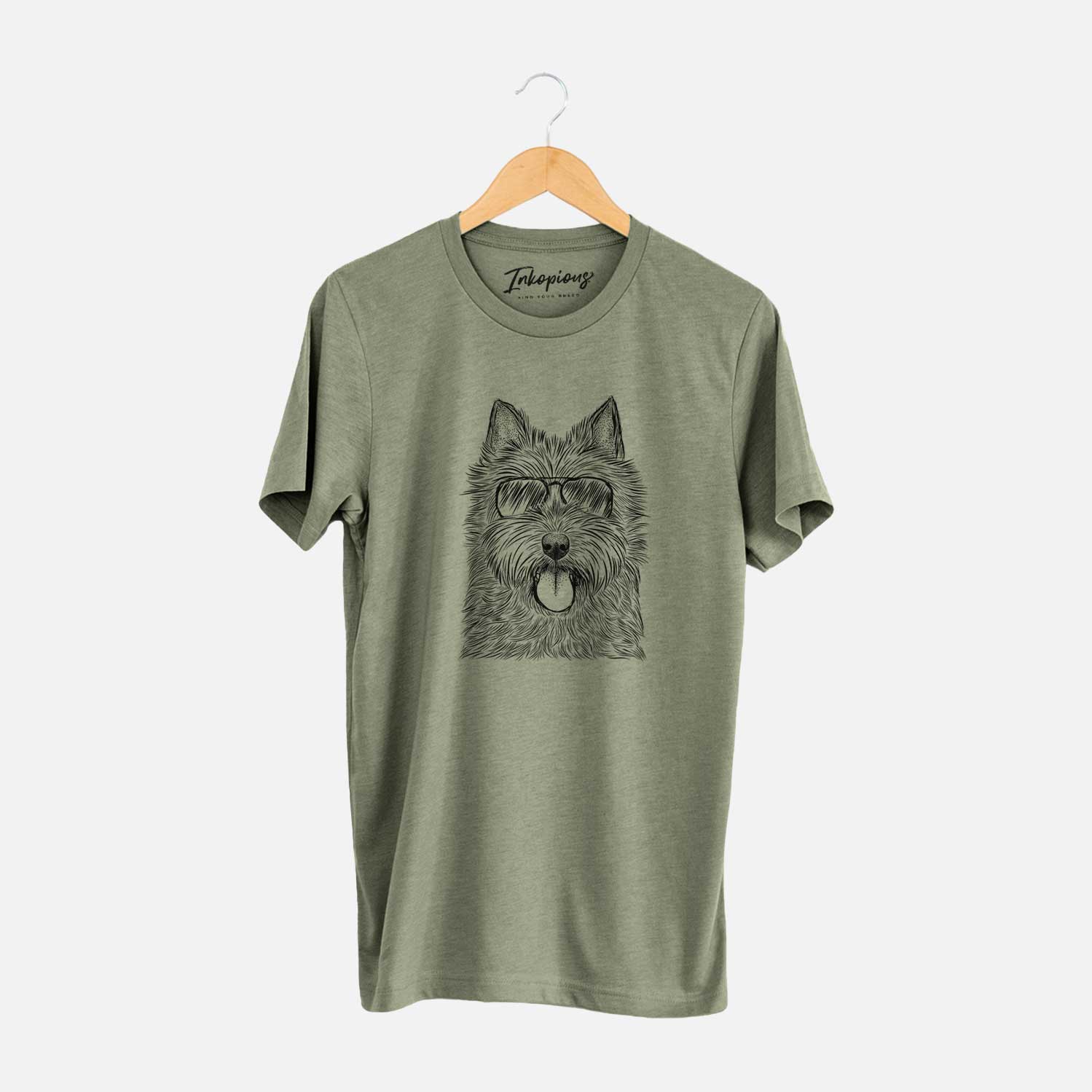 Hand-drawn sketch of Alfie the Norwich Terrier wearing aviator sunglasses on an Olive Unisex crewneck