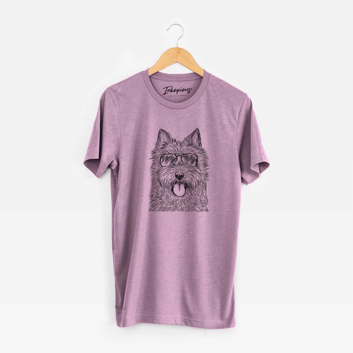 Hand-drawn sketch of Alfie the Norwich Terrier wearing aviator sunglasses on an Orchid Unisex crewneck